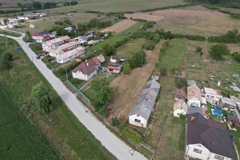 Aerial view of plots - housing near Sea Buckthorn with scattered houses and nature.