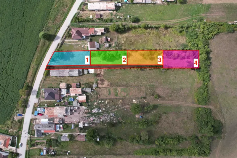 Residential plots in Rakytník divided into sections, surrounded by greenery.