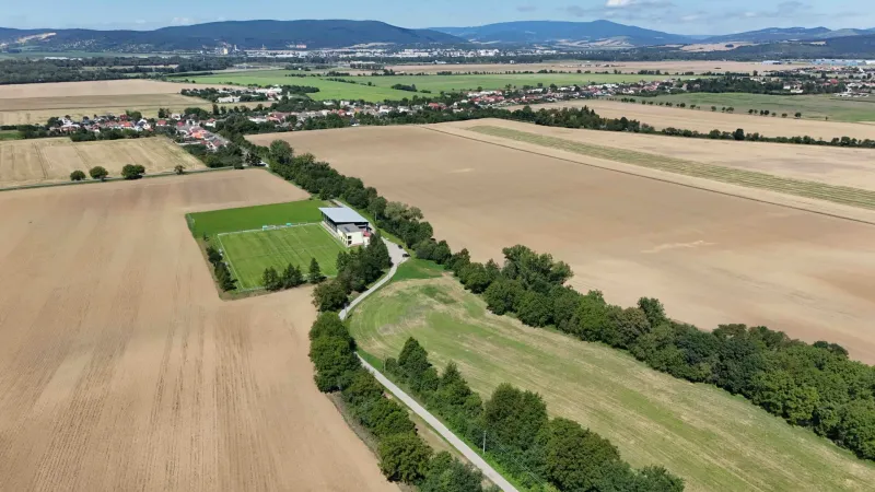 Aerial view of agricultural and forest land around Nová Ves nad Váhom.