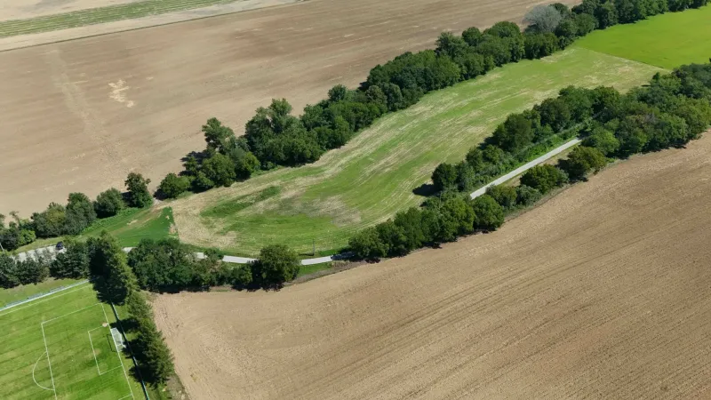 Aerial view of agricultural and forest lands around Nová Ves nad Váhom.