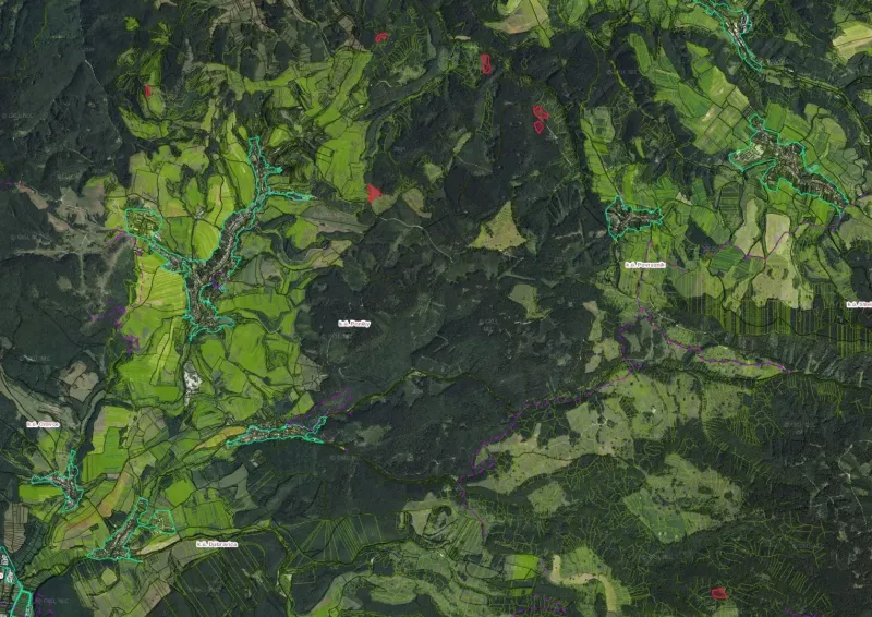 Aerial view of agricultural and forest lands around Poniky.