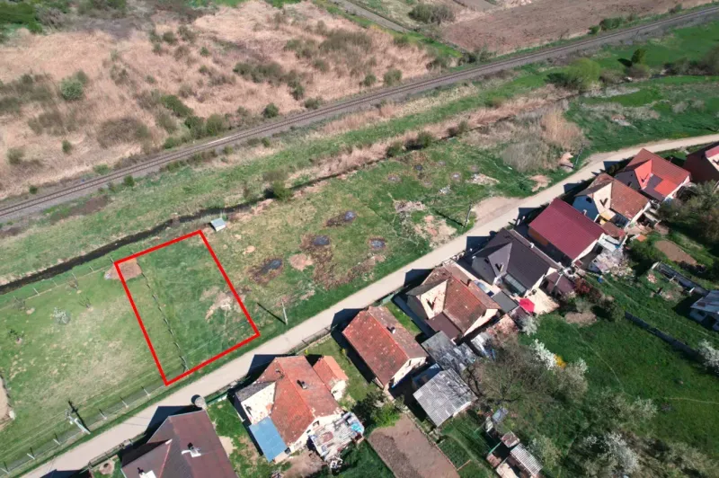 Plots - housing in Hodejov with a view of the railway track and neighboring houses.