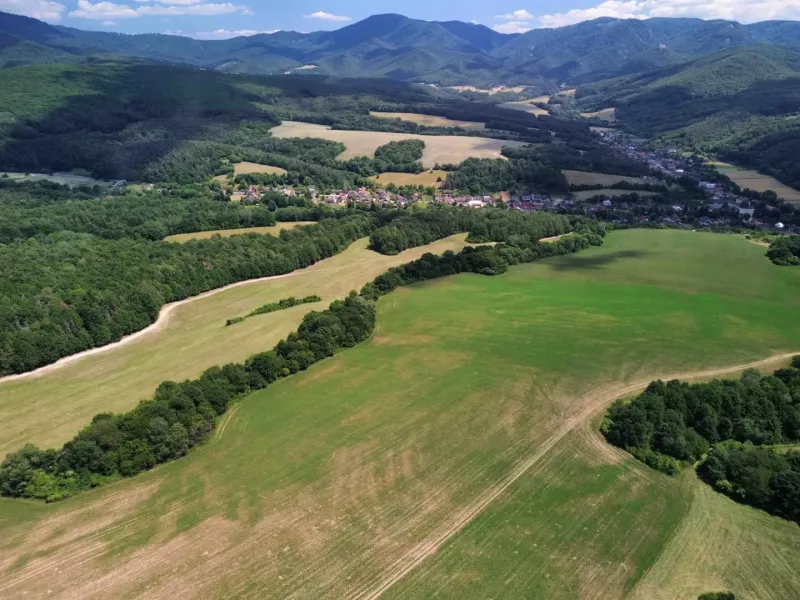 Panorama of agricultural and forest lands in Žitná - Radiša with a view of the mountains.