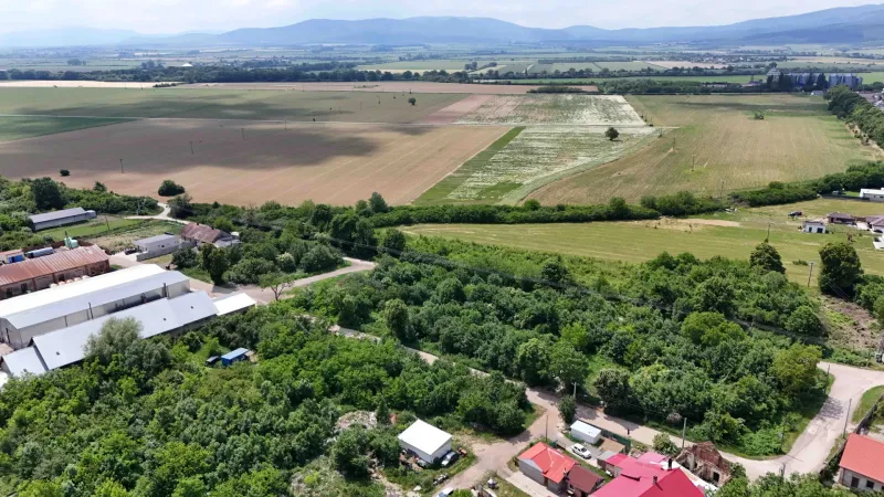 Originating from Parchovany, this photograph captures rural lands surrounded by greenery.