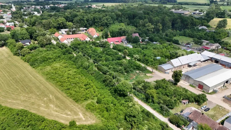 Aerial view of green residential plots in Parchovany with surrounding nature.