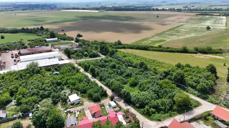 Aerial photograph of residential plots with fields and buildings in Parchovany.