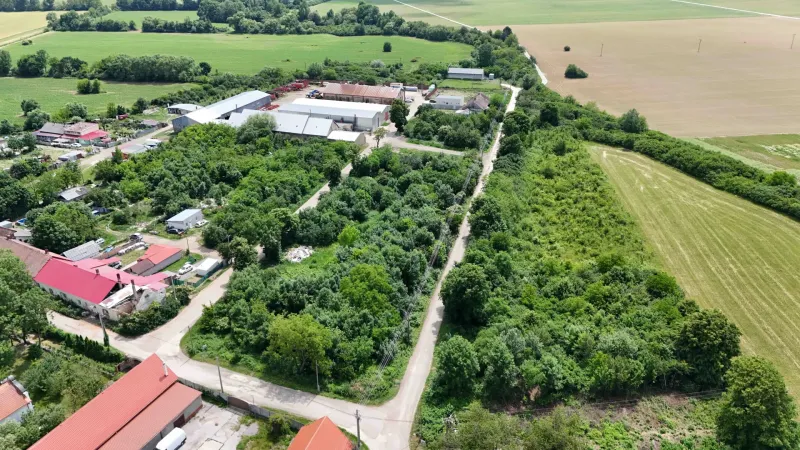 Aerial view of plots in Parchovany, surrounded by greenery and fields.