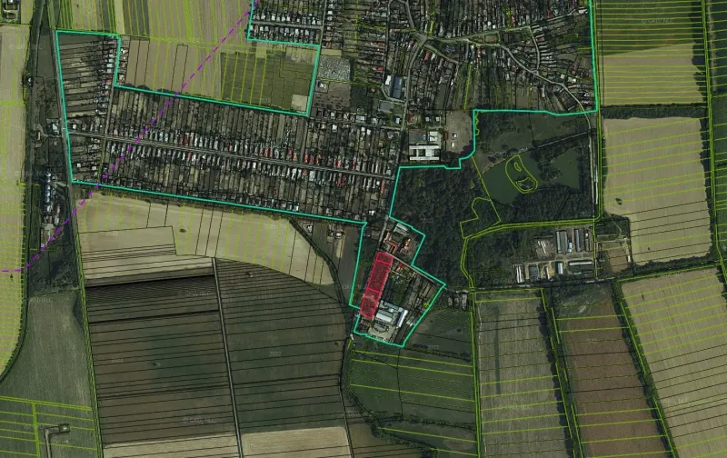 Aerial view of residential plots in Parchovany surrounded by fields and greenery.