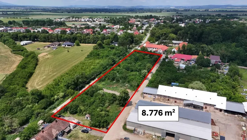 Aerial view of residential plots in Parchovany, surrounded by greenery.