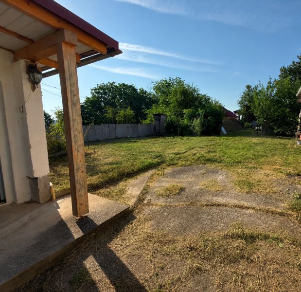 In Veľké Ripňany, there is a garden by a family house with a well-maintained lawn and a gazebo.