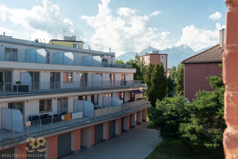 Apartment complex on 9th May Street in the town of Svit with a view of the mountains.