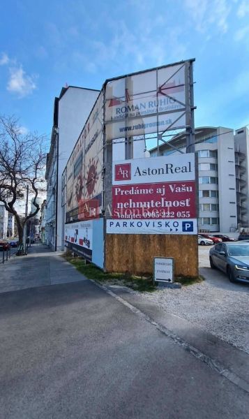 Billboards and buildings along the sidewalk on Štefanicova Street in Bratislava - Old Town.