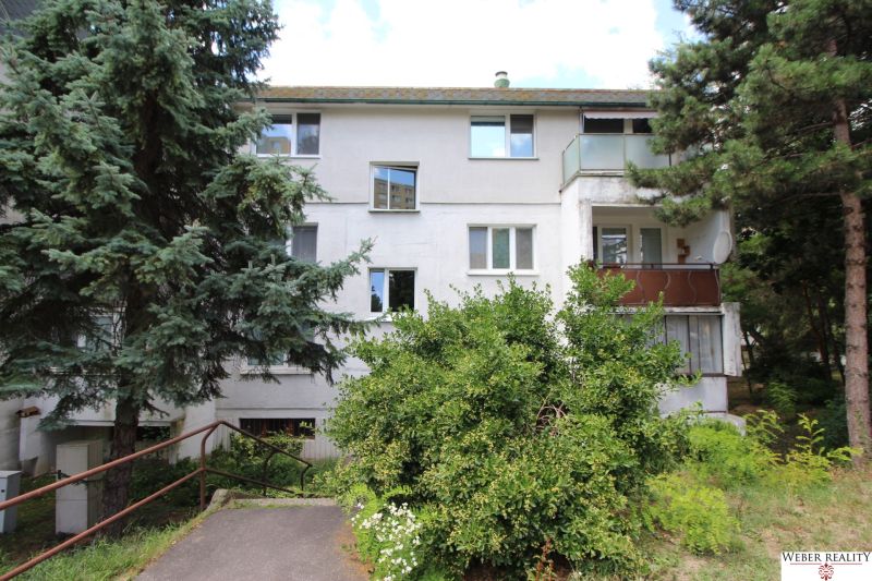 The exterior of an apartment building surrounded by trees, Talichova Street, Bratislava - Dúbravka.