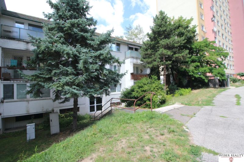 The exterior of an apartment building surrounded by greenery on Talichova Street in Bratislava - Dúbravka.