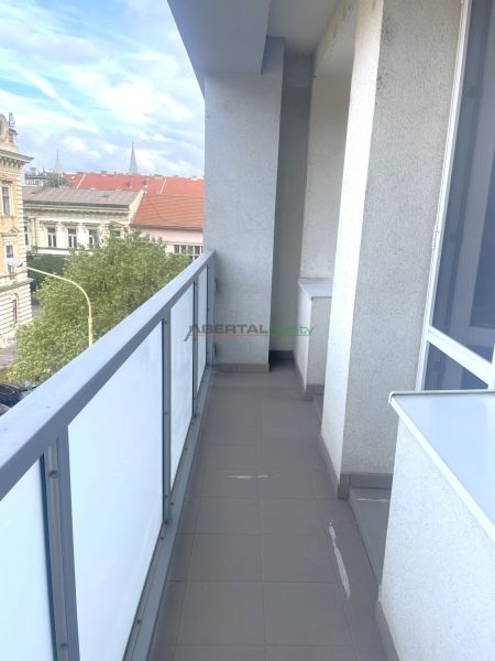 A balcony with a view of historic buildings on Puškinova Street in Košice, 3-room apartment.