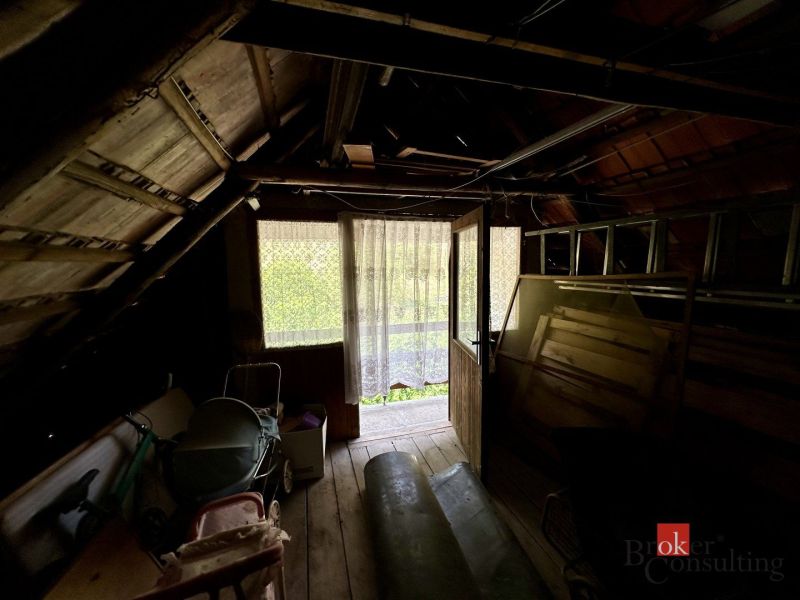 Attic in a family house with wooden decor and natural light.