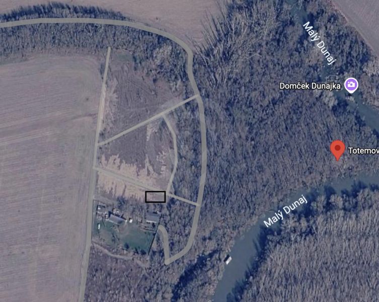Aerial view of agricultural and forest land in Zálesie near the Little Danube River.