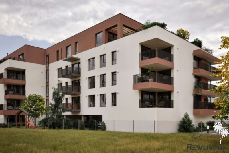 The building on Brigádnicka Street in Piešťany with balconies and greenery, suitable for a 3-room apartment.