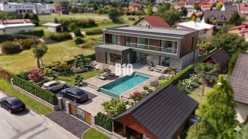 Luxury villa with a pool in Martin - Land - living, surrounded by greenery.