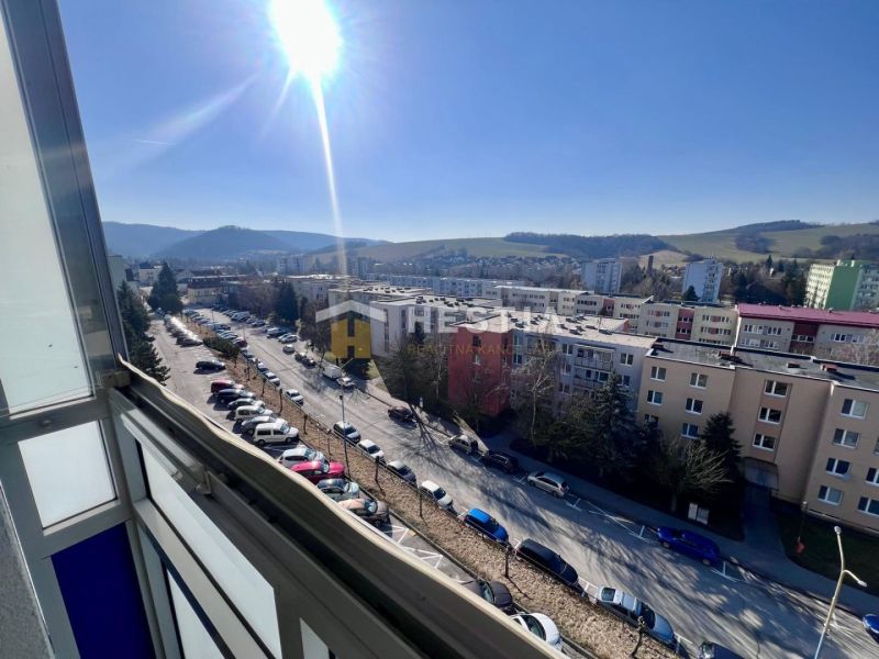 View from a 3-room apartment in Brezová pod Bradlom of the town and parking lot.