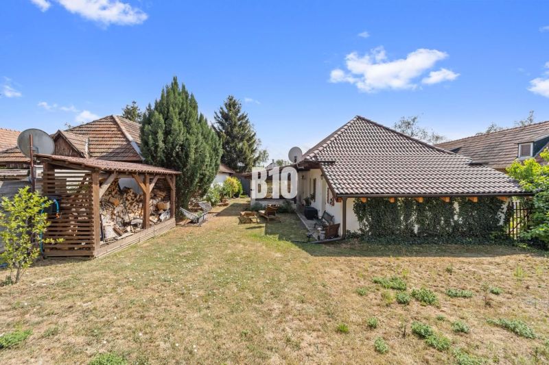 A family house in Podhájska with a landscaped garden and a woodshed for dry wood.