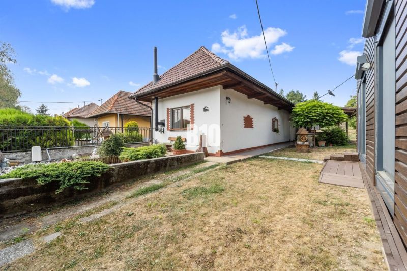 A family house in Podhájska with a well-maintained garden and traditional architecture.