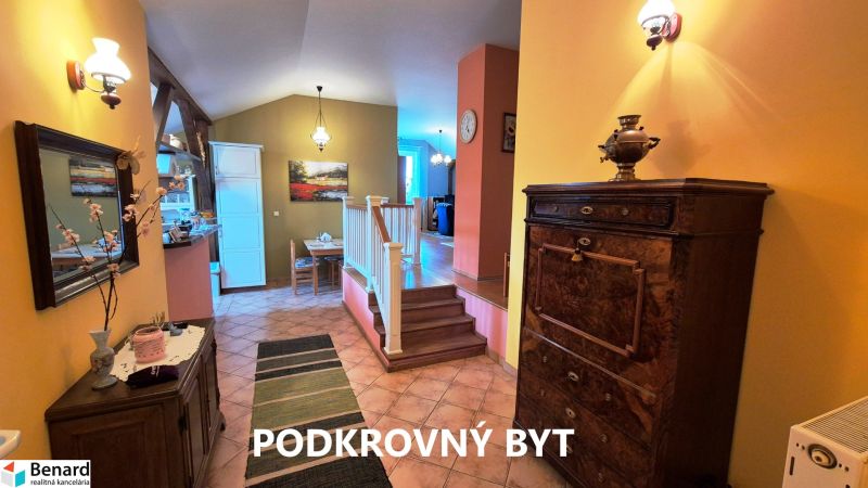 Interior of a family house with colorful walls and wooden furniture.
