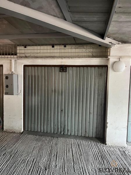 Closed iron garage doors in garages on Púpavová Street in Bratislava - Karlova Ves.