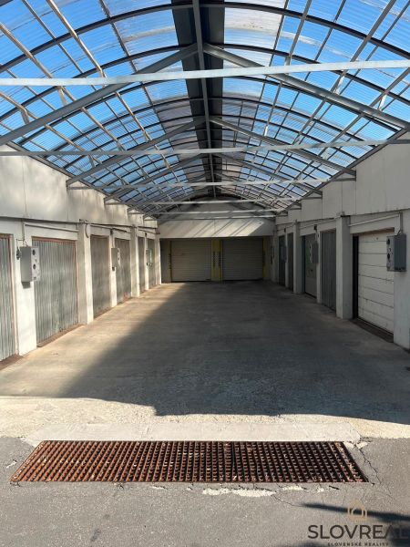 Garages on Púpavová Street in Bratislava - Karlova Ves with a glass roof.