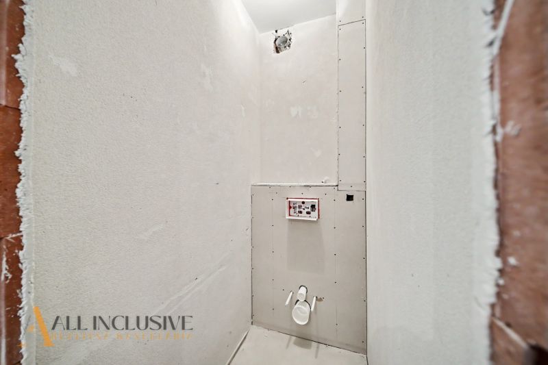 Bathroom renovation in a 2-room apartment with pre-installed water piping.