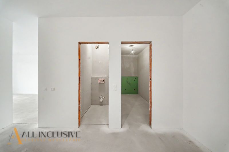 Empty rooms in a 2-room apartment, ready for furnishing.
