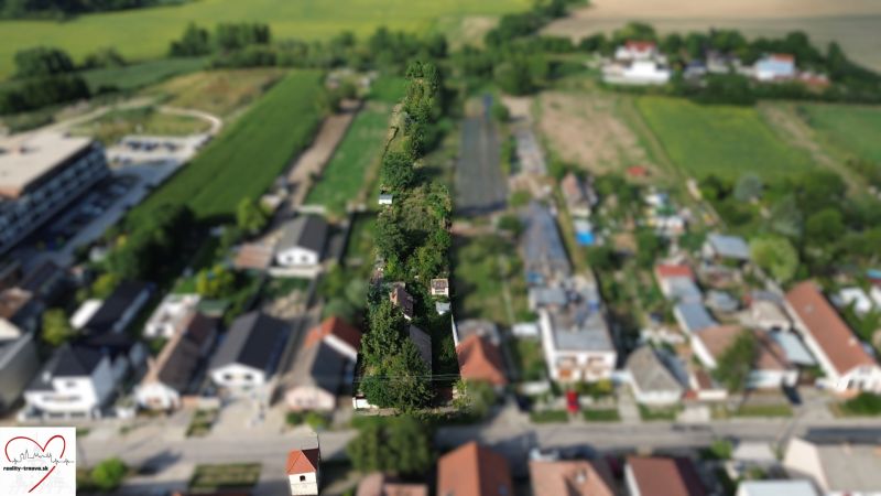 Aerial view of gardens and houses in the area of Plots - housing in Banská Bystrica.