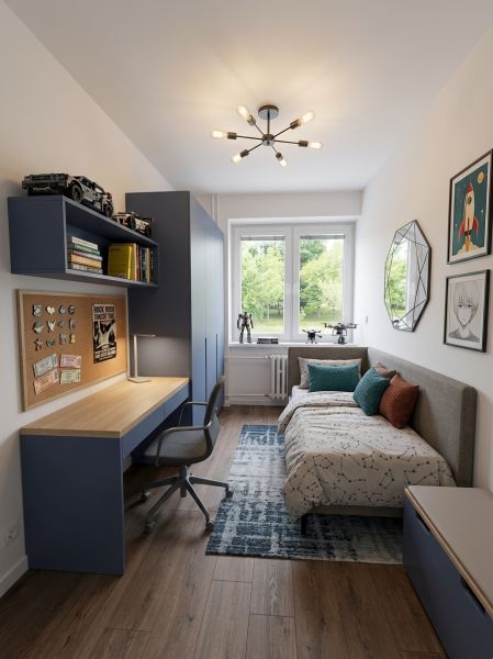 Children's room with a bed, a desk, and a floor with a wooden decor in a 4-room apartment.
