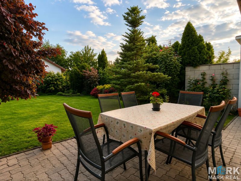 The terrace of a family house on Hrabová Street in Hamuliakovo with an outdoor table and chairs.