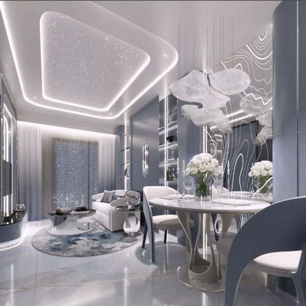 Interior of a holiday apartment with luxurious lighting, a dining table, and an elegant sofa.