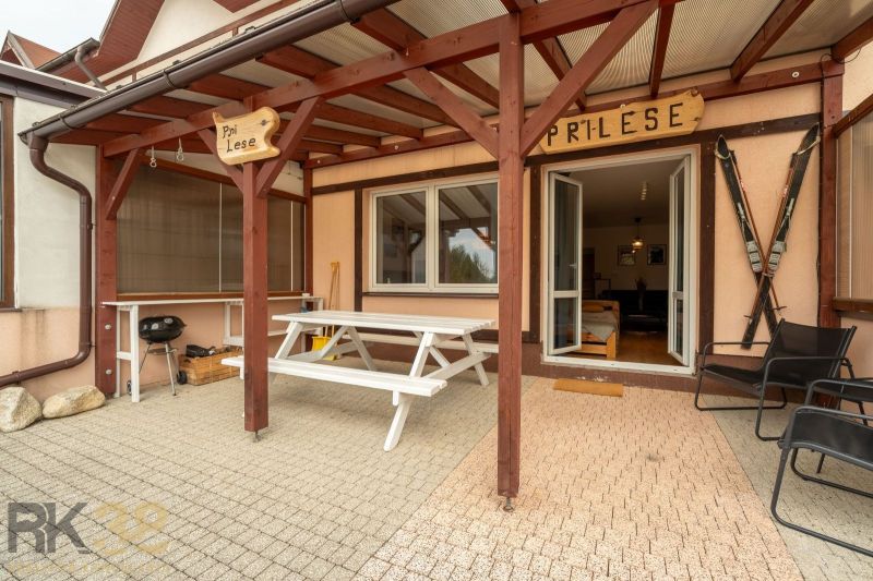 Terrace of a 2-room apartment in Poprad with seating and a grill.