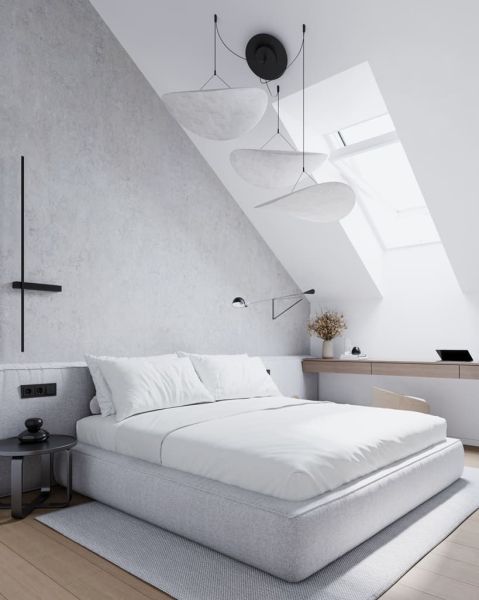 A bedroom in a studio apartment with a bed, a skylight, and a wooden decor floor.