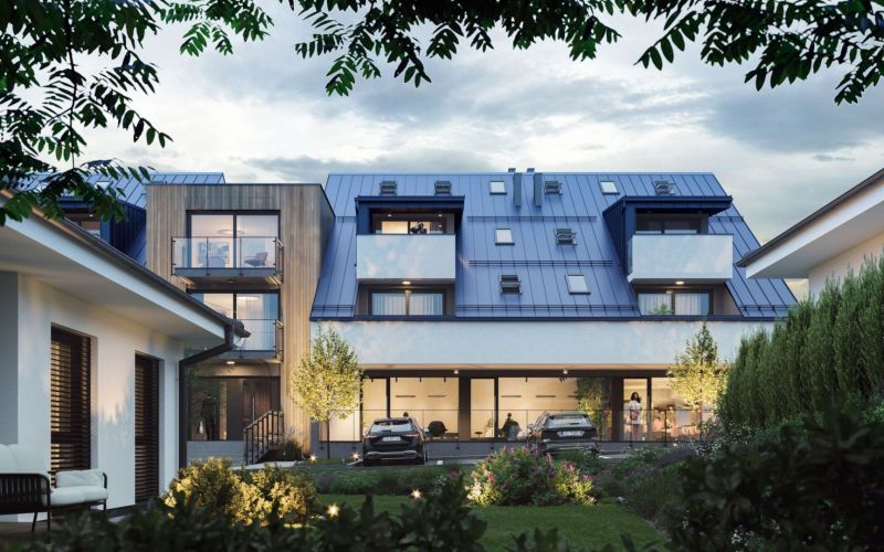 A modern building with tiered balconies and two cars in Mlynica.