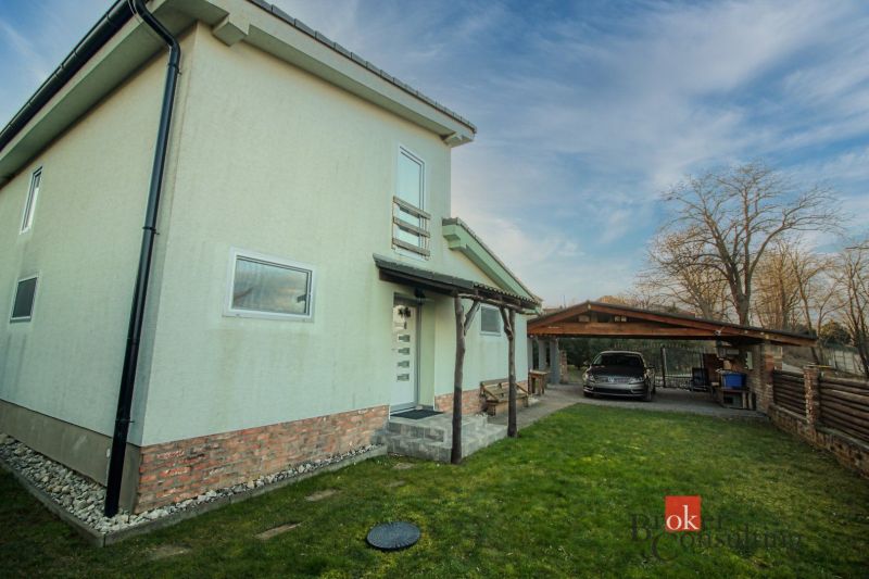 A family house in Suchá nad Parnou with a garage and a green yard.