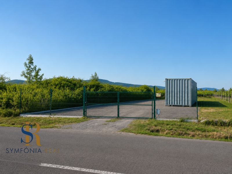 Lands - housing on street 504 in Modra, green fence, container.