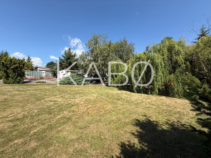 Garden with lawn and trees in the Čaradice area, suitable for residential plots.