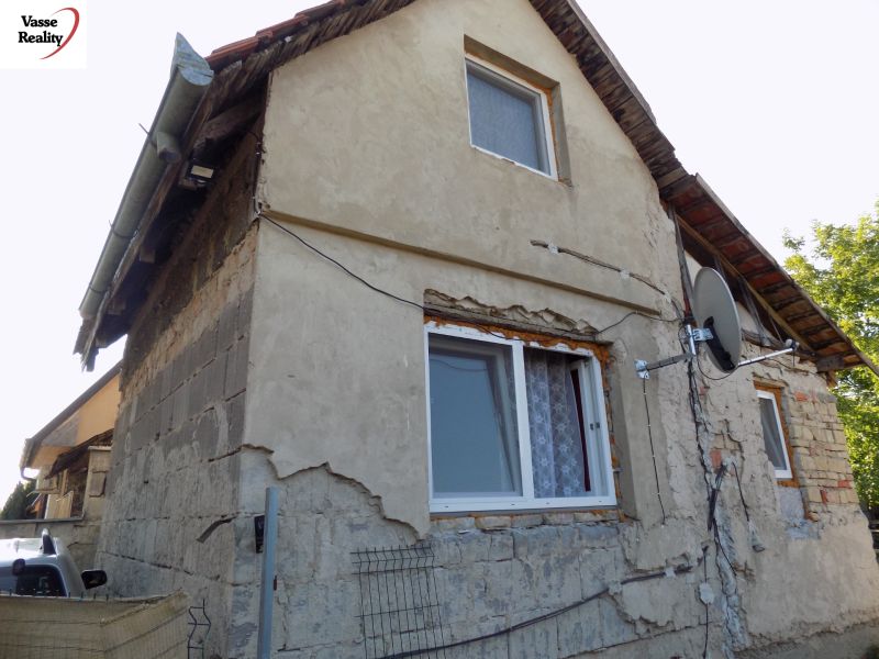 Abandoned cottage on Pumpkin Field in Nové Zámky with damaged facade.