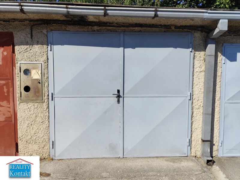 Garages in Nové Zámky with a solid metal entrance and plastered wall.