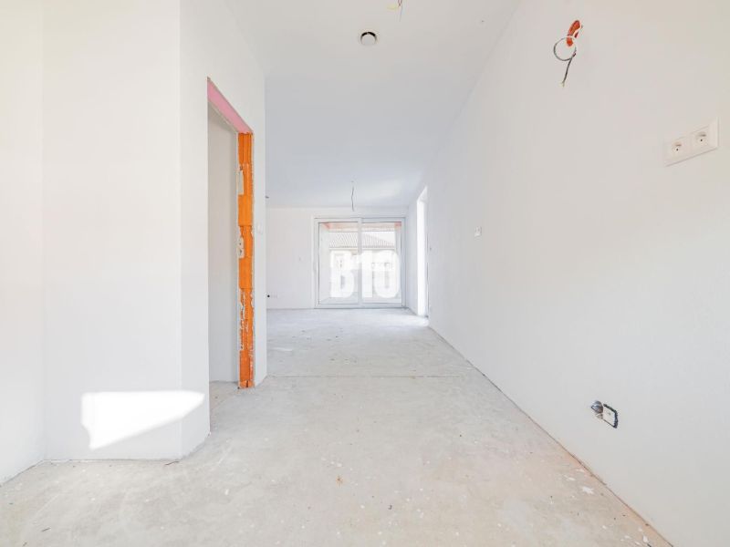 A practical view into the interior of a family house with a cement floor and distribution panel equipment.
