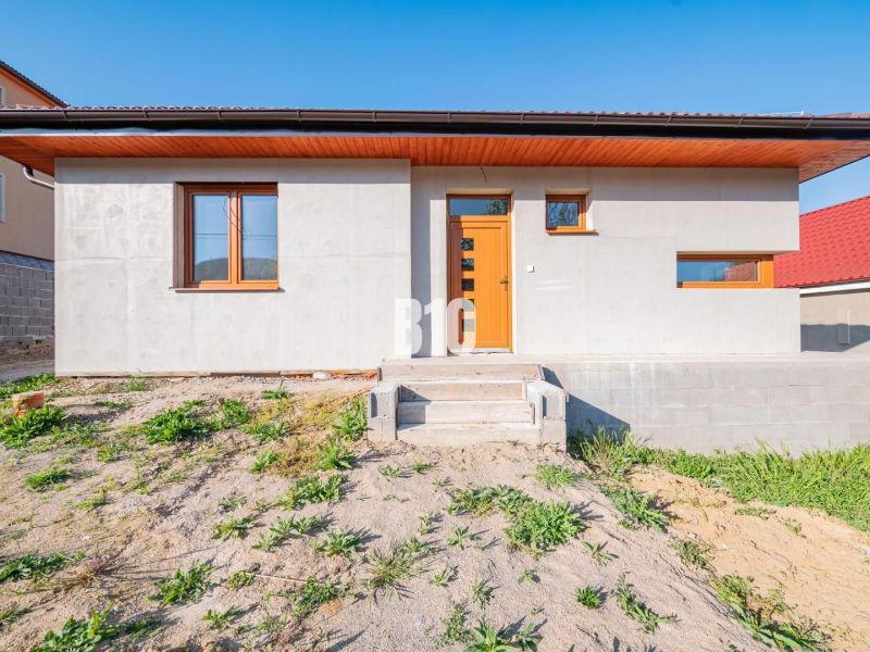A family house in Nitra with a light facade and entrance stairs.