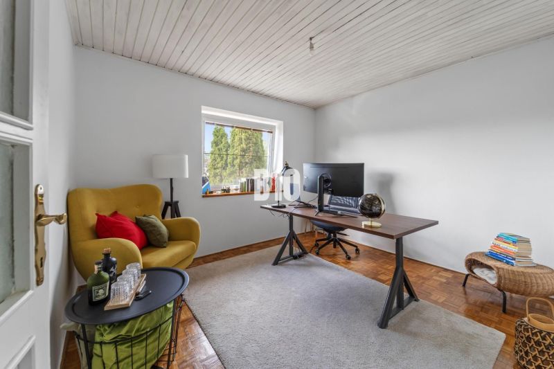 Yellow chair, work desk with a monitor, wooden decor flooring, family house.