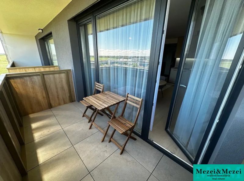 A balcony with wooden seating in a 1-room apartment on Gen. Goliána Street in Trnava.