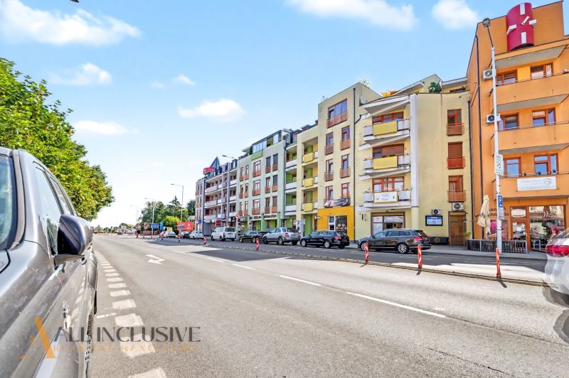 Galantská cesta Street in Dunajská Streda with parked cars and apartment buildings.