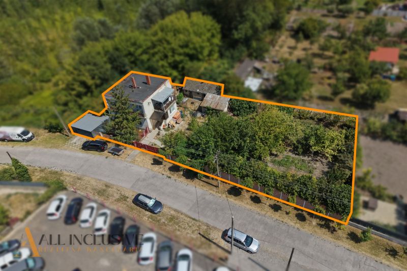 A family house in Bodza with an extensive garden, parking, and a fenced plot.