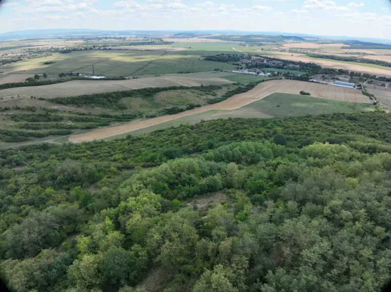 Agricultural and forest land in Tornaľa with a panoramic view of the surrounding countryside.